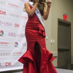 Miss Nevada Nia Sanchez poses in a taekwondo martial art stance for the media at a news conference after she won the 2014 Miss USA beauty pageant in Baton Rouge, Louisiana