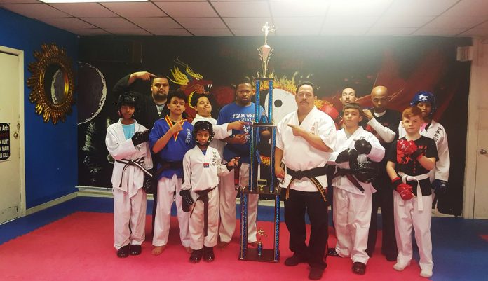 Austin Wright with class and martial arts trophey