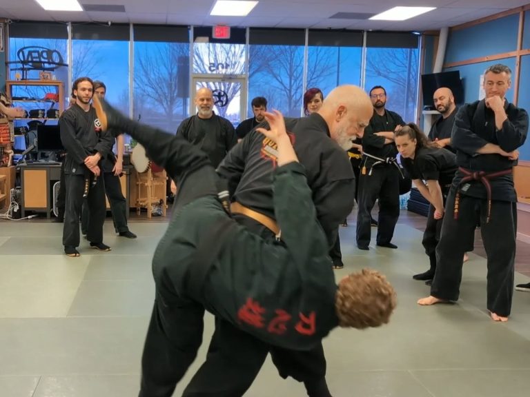 Stephen Hayes throw a man in a dojo.